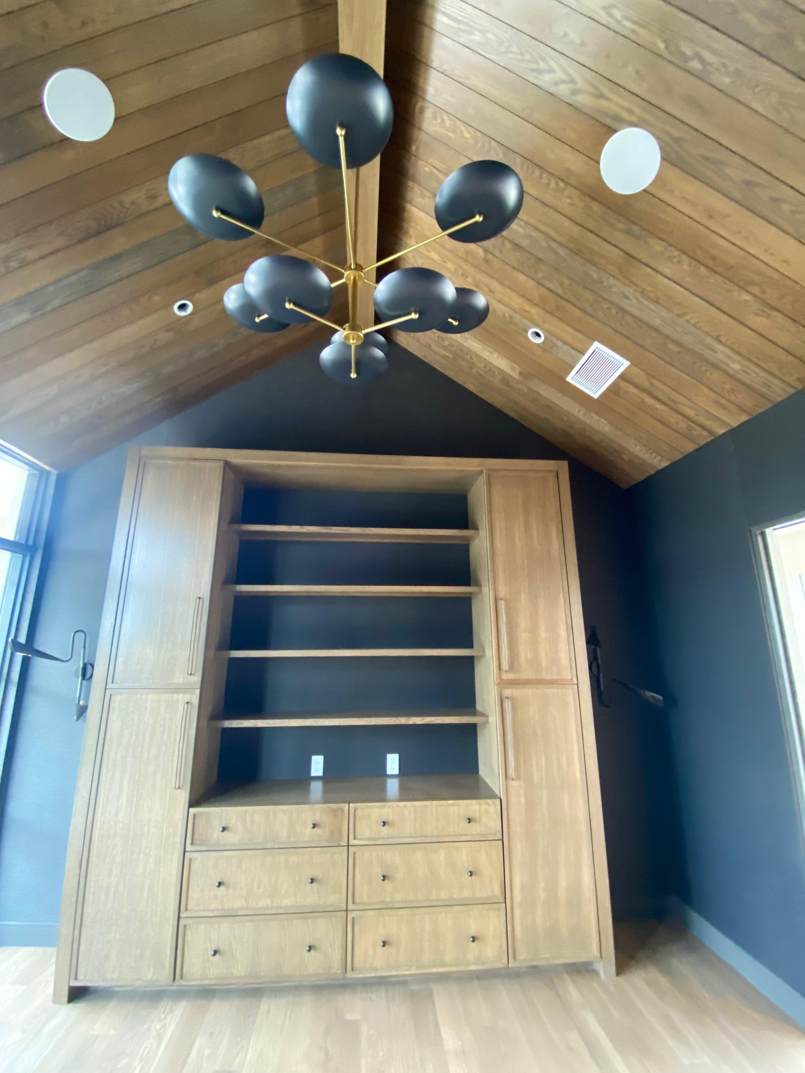 Custom builtin dark wood vaulted ceiling